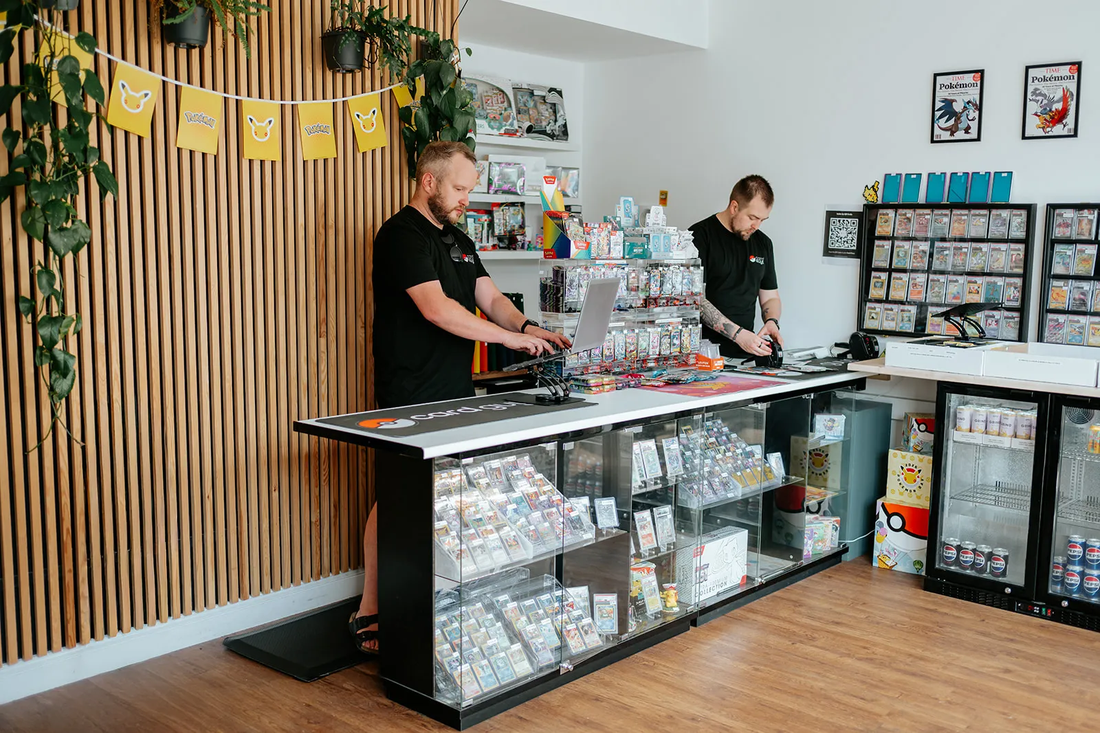 Jake and Dan behind the counter at Card Guys